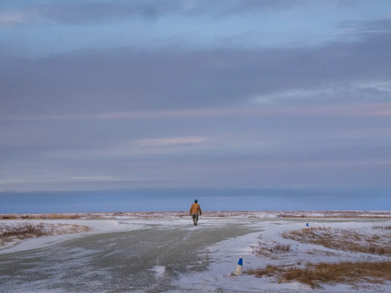 Houses floated away in this Alaska Native village. Now residents want to move 11 A Kwigillingok resident waits for a flight to land.