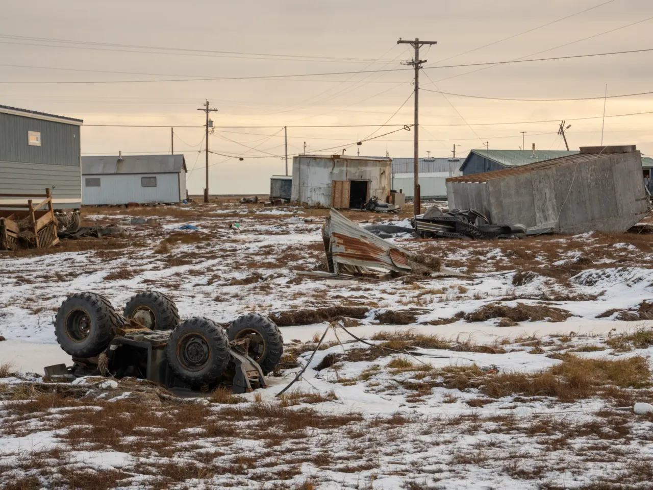 A building and an all-terrain vehicle are overturned in Kwigillingok, Alaska, in late October. The village was hit by the remnants of Typhoon Halong that month, which caused major damage to homes and displaced most residents.