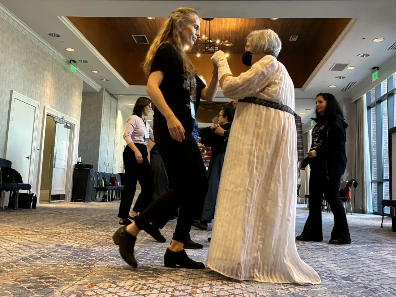 All about character: Jane Austen fans on their favorites 1 Tessa Harings (left) learns English country dance at the Jane Austen Society of North America's 2025 Annual General Meeting