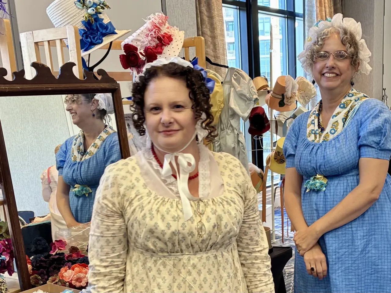 All about character: Jane Austen fans on their favorites 4 Milliner Dannielle Perry (right) and her assistant Mia Berg of Timely Tresses in their Regency-era togs.