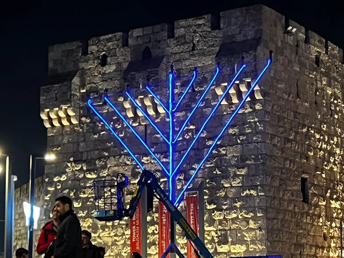 Bondi Beach attack casts a shadow on Hanukkah celebrations in Israel 1 A large menorah stands outside the walls of the Old City in Jerusalem, ready for daily ceremonies to light the candles every night.