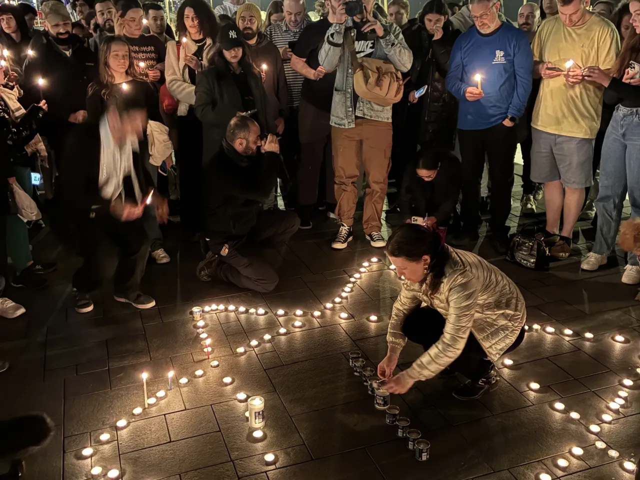 Bondi Beach attack casts a shadow on Hanukkah celebrations in Israel 2 At a vigil in Tel Aviv for the victims of Australia's Bondi Beach attack, candles are laid out in the shape of a Star of David, Dec 14.