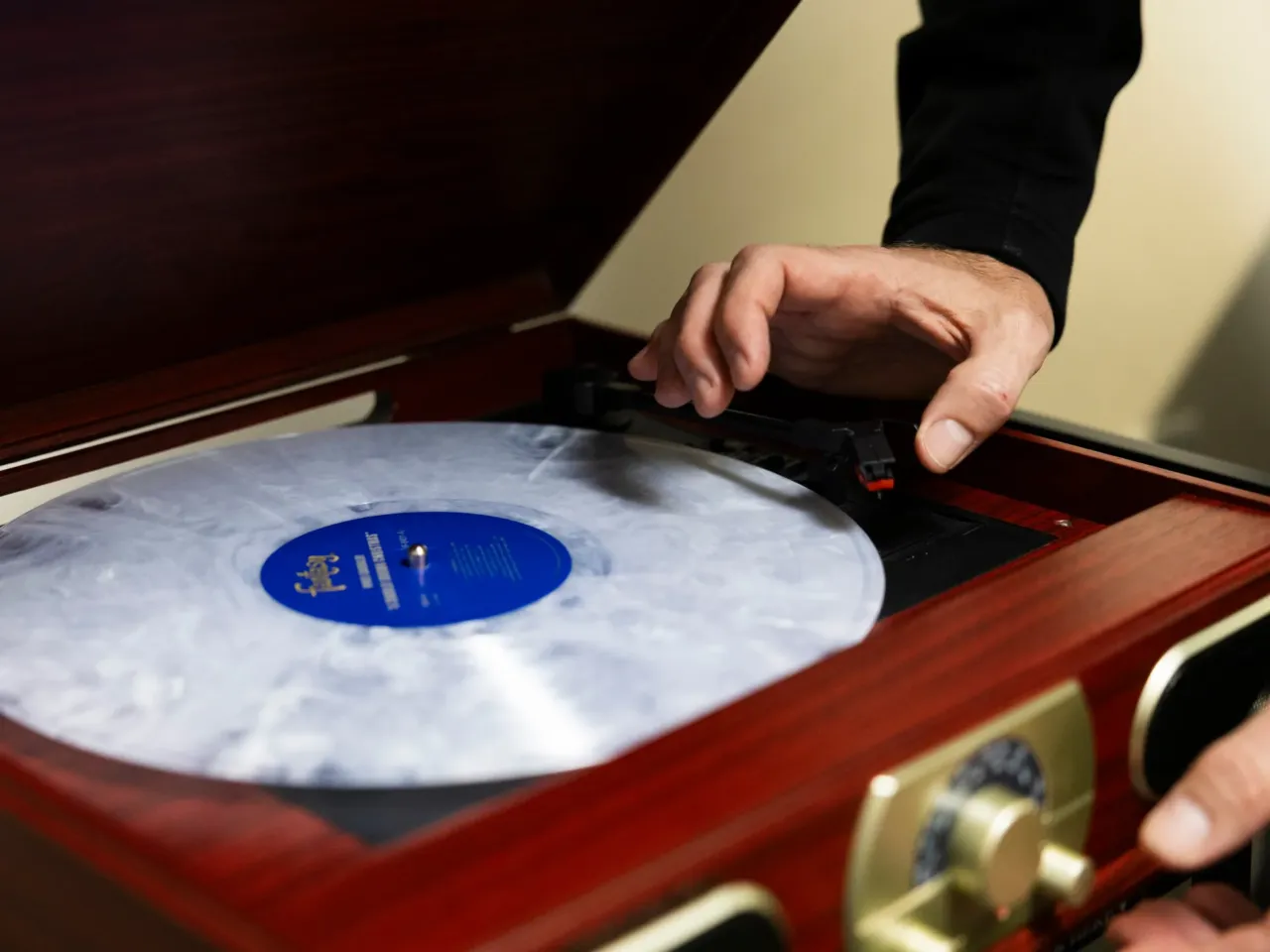 Dr. Tyler Jorgensen, a palliative care doctor at Dell Seton Medical Center, plays a Charlie Brown Christmas album in an office on December 9, 2025. Ferguson said this album is popular due to the lack of lyrics, which makes for easier listening.