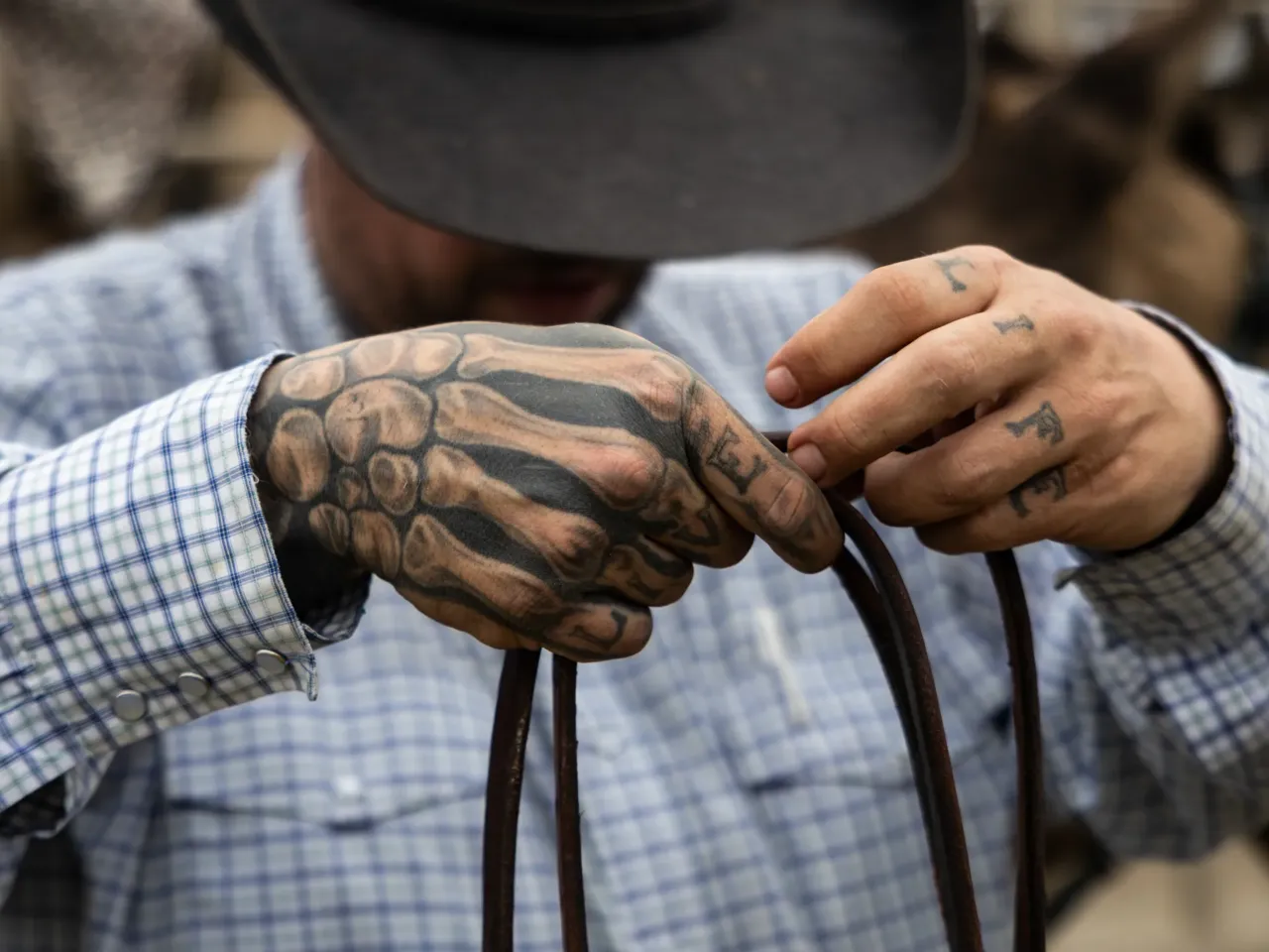 2025: The images that stayed with us 1 Mason "Bric" LaDue, a hip-hop music industry professional turned cattle rancher, takes the reins off of his horse, Valero, on Feb. 5, 2025, at his family's ranch in Marquez, Texas.
