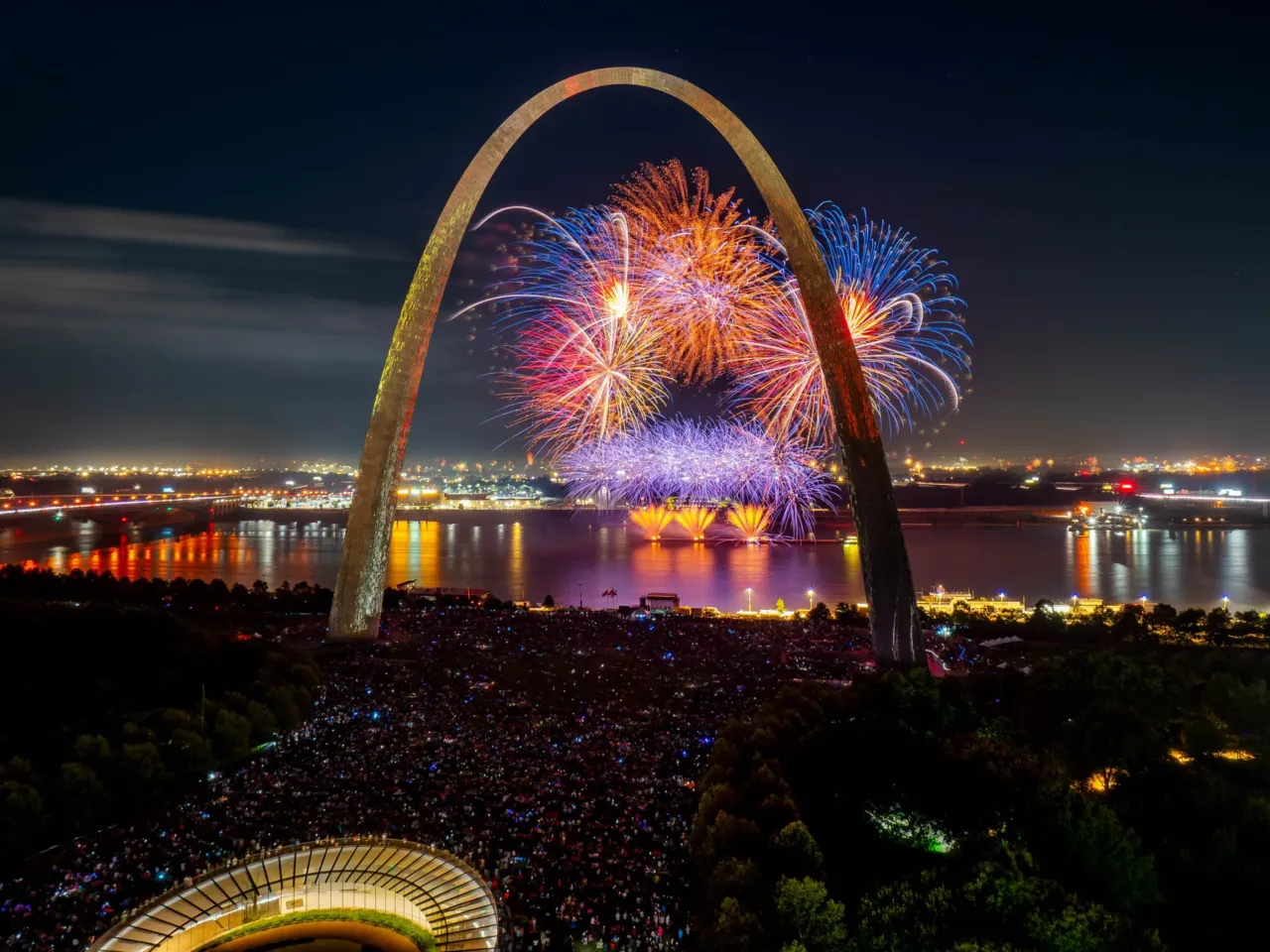 2025: The images that stayed with us 3 Thousands gather as fireworks light up the sky behind the Gateway Arch on Friday, July 4, 2025, in downtown St. Louis. The display celebrated the country's 249th anniversary.