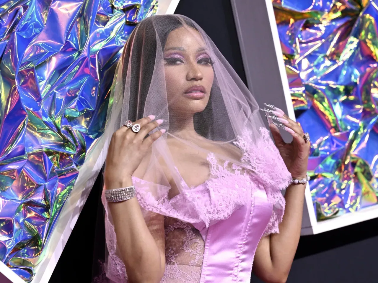 How the ICE shooting in Minneapolis and calls to deport Nicki Minaj are related 1 Nicki Minaj arrives at the MTV Video Music Awards on Sept. 12, 2023, at the Prudential Center in Newark, N.J. (Photo by Evan Agostini/Invision/AP, File)