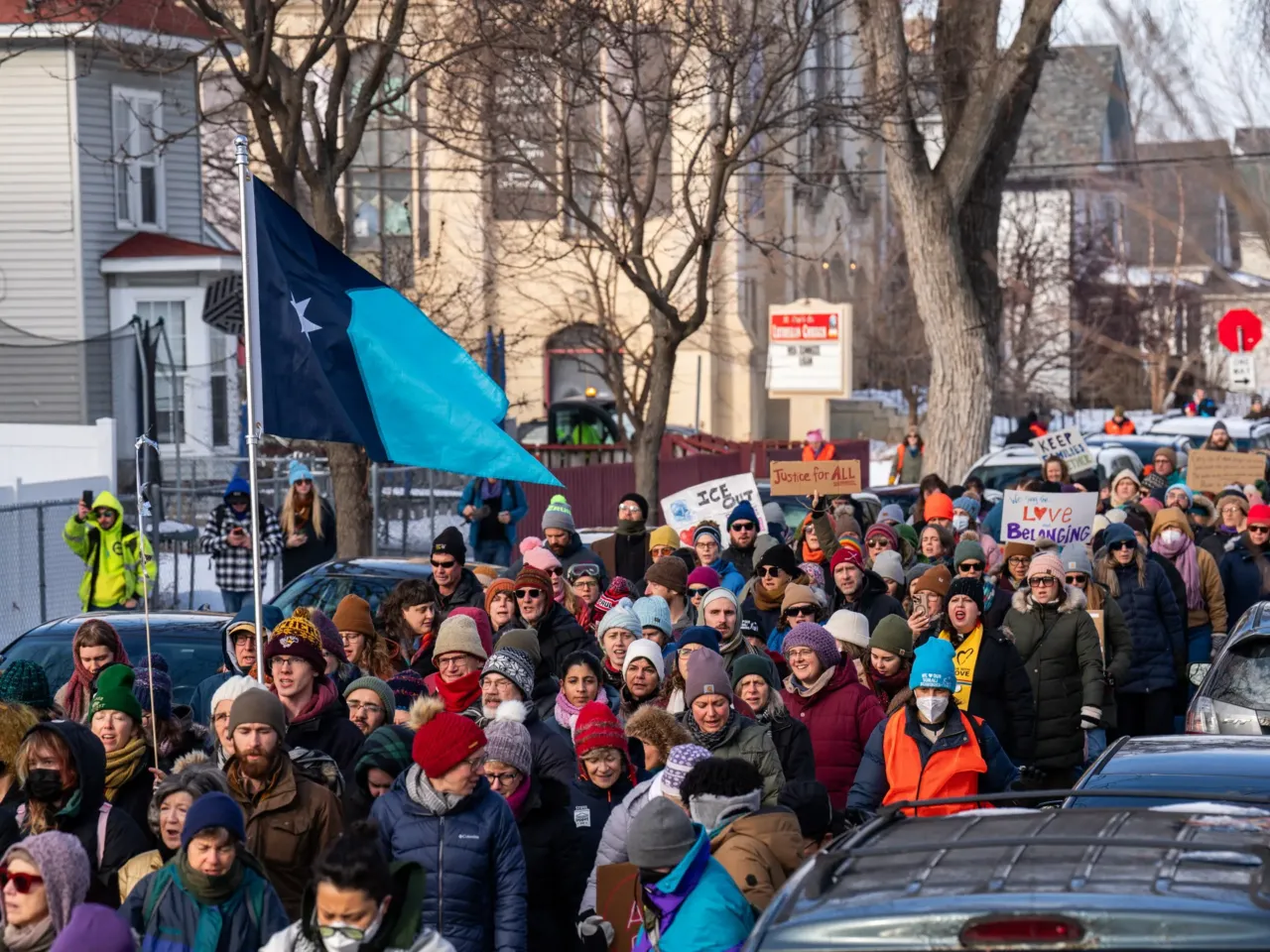 Participants in a singing vigil leave St. Paul's-San Pablo Lutheran Church to march around the Phillips neighborhood on Sunday, Jan. 11, 2026 in memory of Renee Macklin Good after she was killed by an ICE agent earlier in the week in Minneapolis.