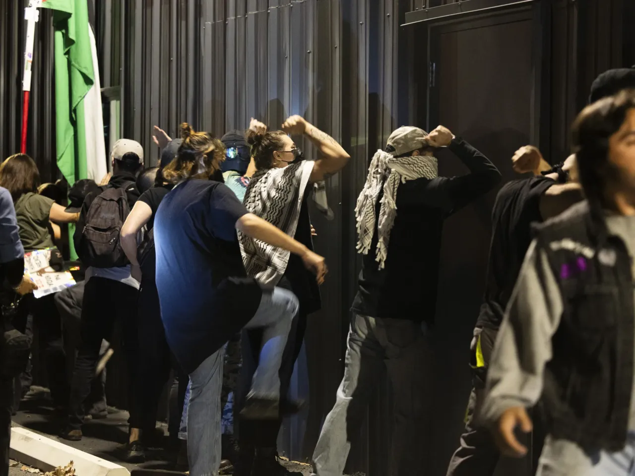 Protesters bang on the outside of the Department of Homeland Security building in Pflugerville, Texas, on Jan. 8, 2026. The protest, preceded by one organized by the Austin chapter of the Party for Socialism and Liberation, came after ICE agents shot and killed Renee Macklin Good in Minneapolis, Minnesota.