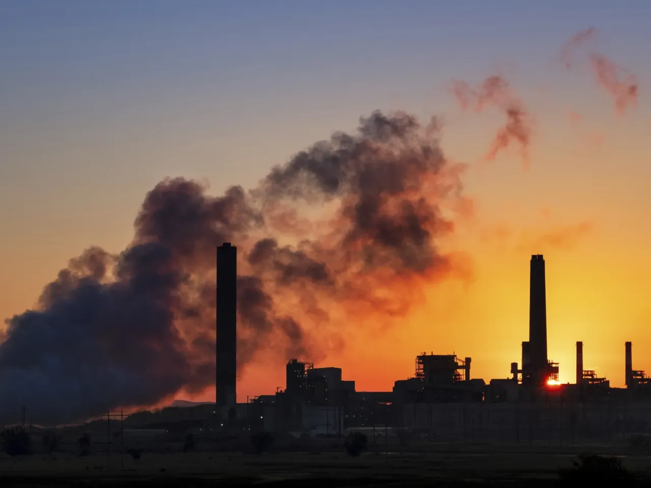 Steam and pollution emerge from a coal-fired power plant in Wyoming. The Environmental Protection Agency under President Trump is taking a new approach to regulating air pollution. In a reversal from previous policy, the EPA will not put a dollar value on potential health benefits from regulations. Critics say that could make it easier to roll back regulations.