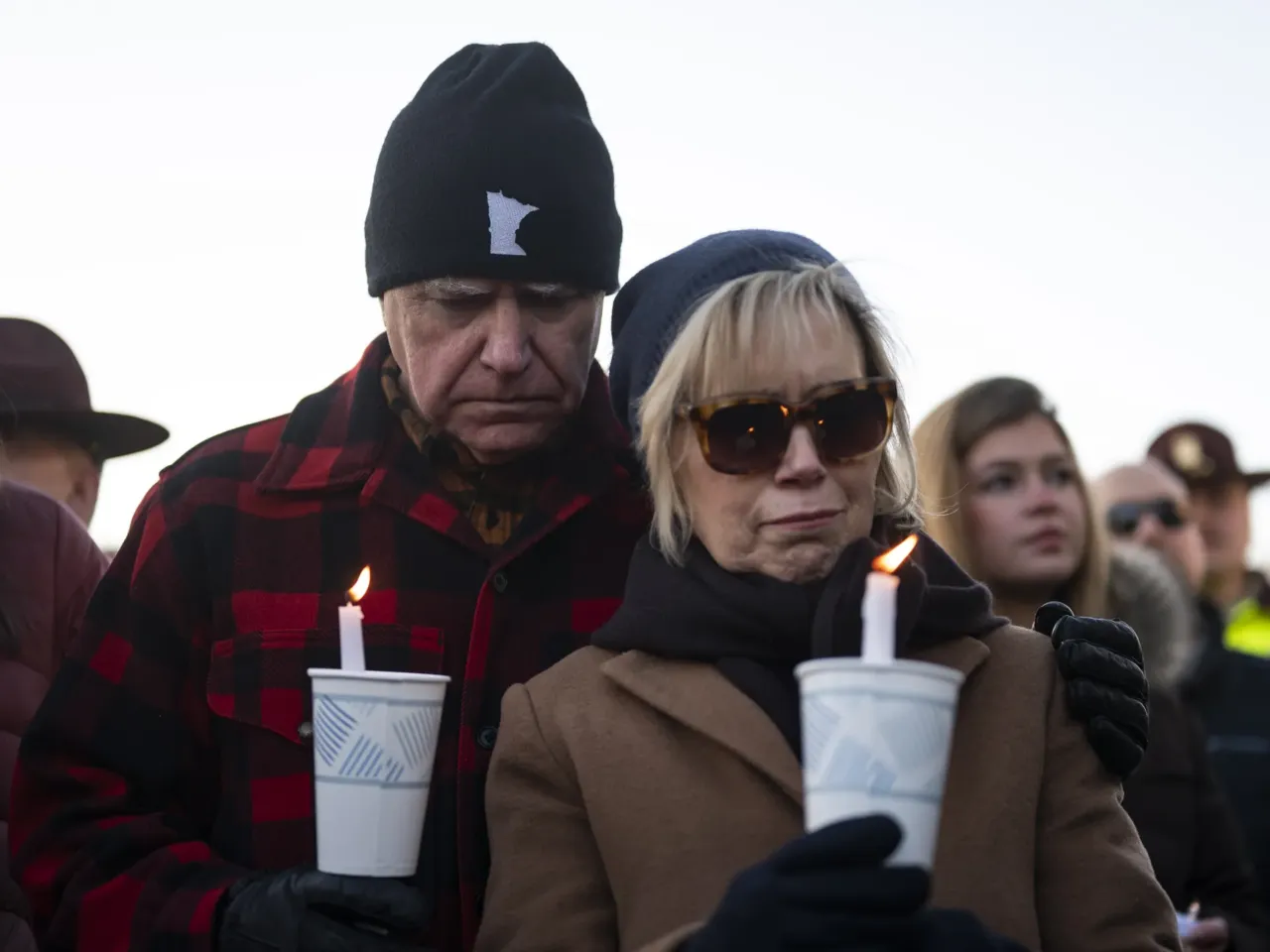 With limited political power, Minnesota Democrats navigate resistance to Trump 2 Minnesota Gov. Tim Walz and his wife, Gwen Walz, look on during a vigil for Renee Macklin Good on the steps of the state Capitol on Jan. 9 in St. Paul, Minn.