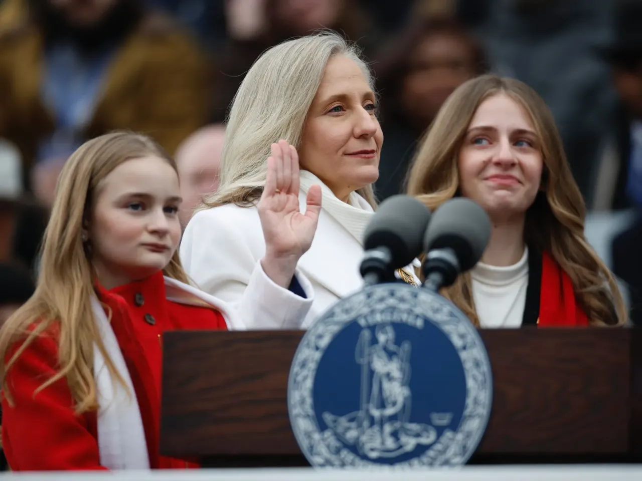 Abigail Spanberger is sworn in as Virginia's 75th governor on Sat. 17, 2025, using a bible held by husband Adam Spanberger, and joined by their daughters Claire, Charlotte and Catherine.