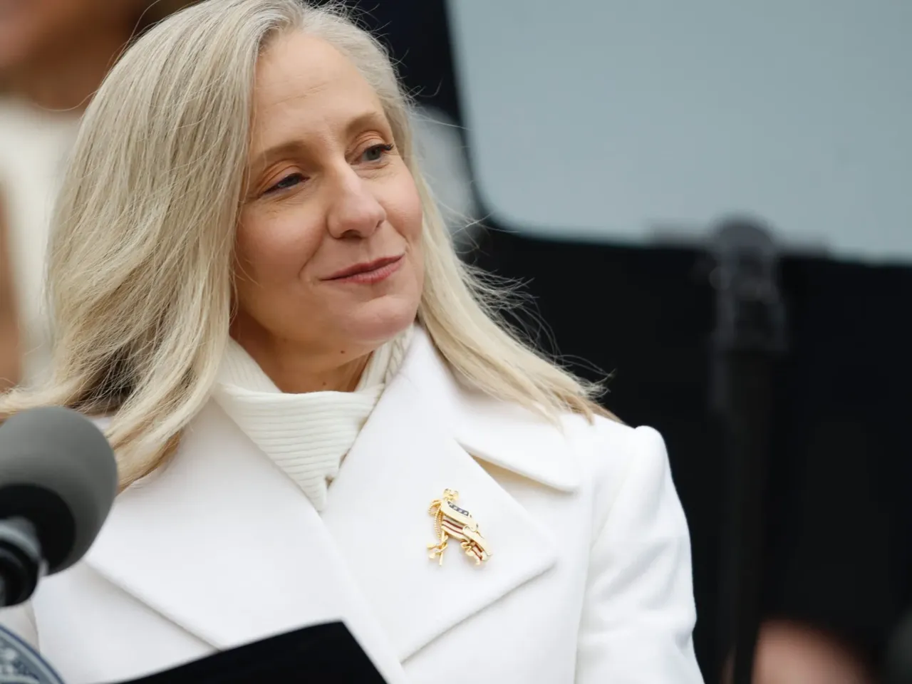 Abigail Spanberger is sworn in as Virginia's 75th governor on Sat. 17, 2025, using a bible held by husband Adam Spanberger, and joined by their daughters Claire, Charlotte and Catherine.