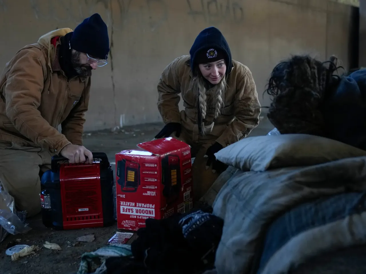 As the winter storm rages, here's what to know in your state 3 Jim Matthess, left, and Morgan McLuckie with the Orange Tent Project nonprofit set up a propane heater for an unhoused individual during dangerously cold temperatures Friday, Jan. 23, 2026, in Chicago.