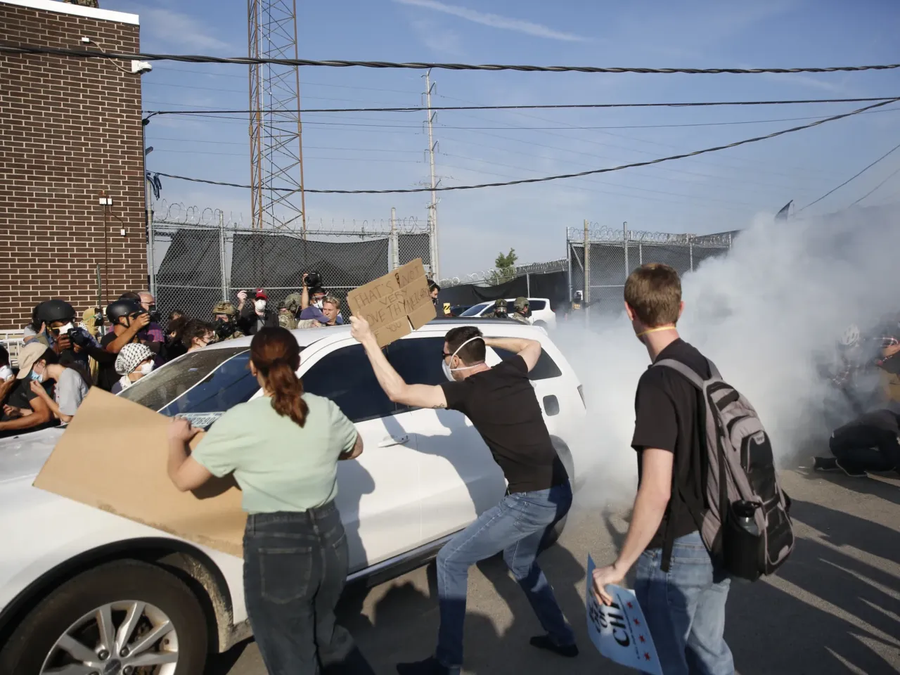 DHS keeps making false claims about people. It's part of a broader pattern 5 Demonstrators try to stop a car leaving an ICE processing center during a protest in Broadview, Ill., on Sept. 19, 2025.