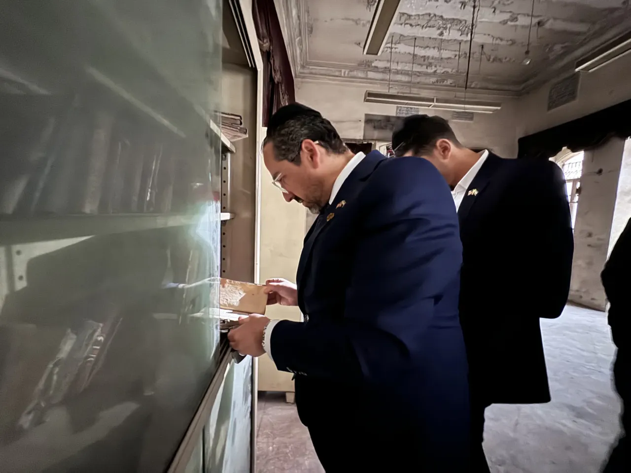 Syria, once home to a large Jewish community, takes steps to return property to Jews 3 Henry Hamra examines religious texts in a small Jewish school in Aleppo, Syria.