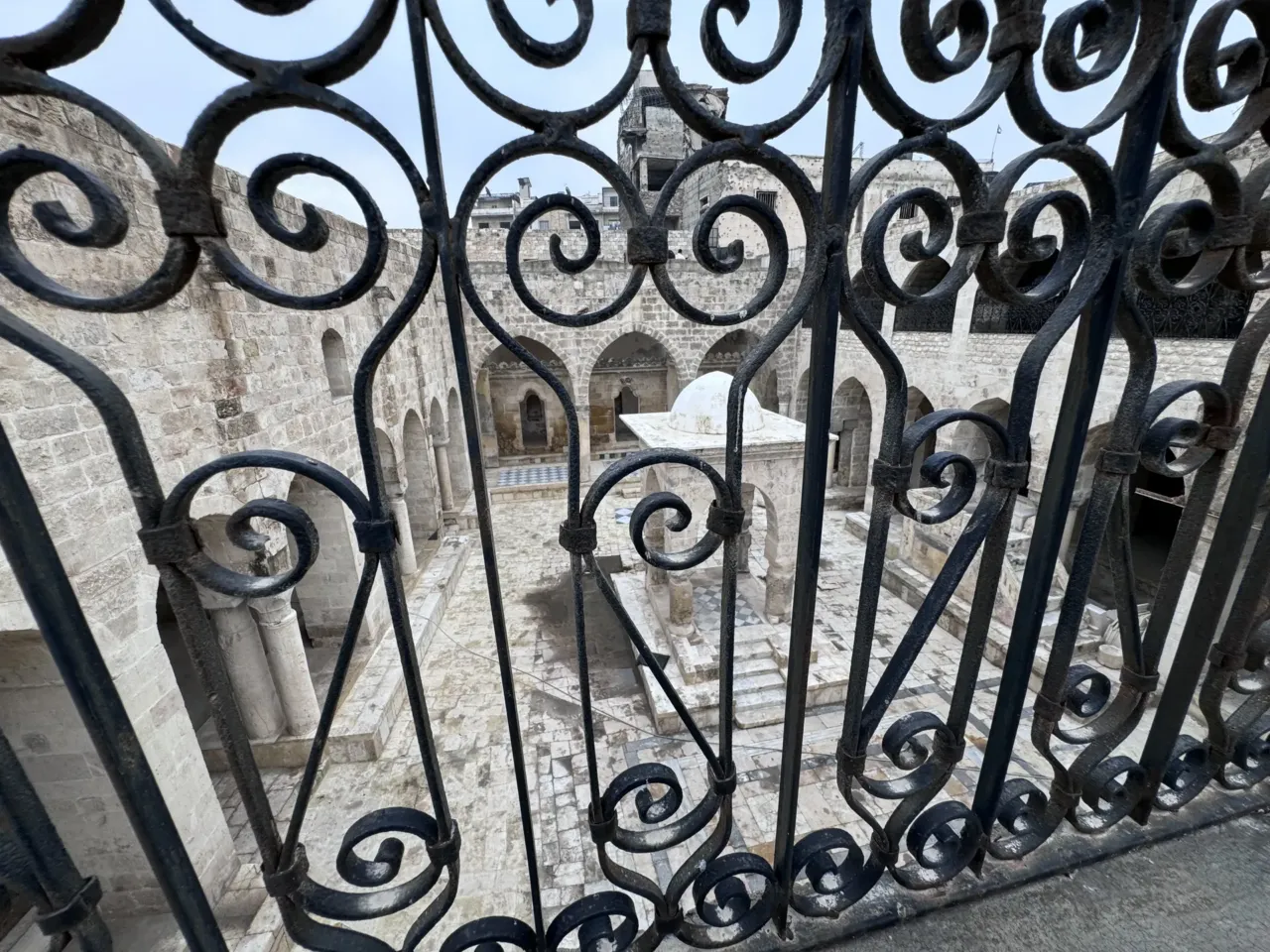 Syria, once home to a large Jewish community, takes steps to return property to Jews 4 The view from the women's section at Aleppo's Central Synagogue, also known as al-Bandara Synagogue. The iron grates on the second floor allowed women to attend prayers without being seen by male worshippers.