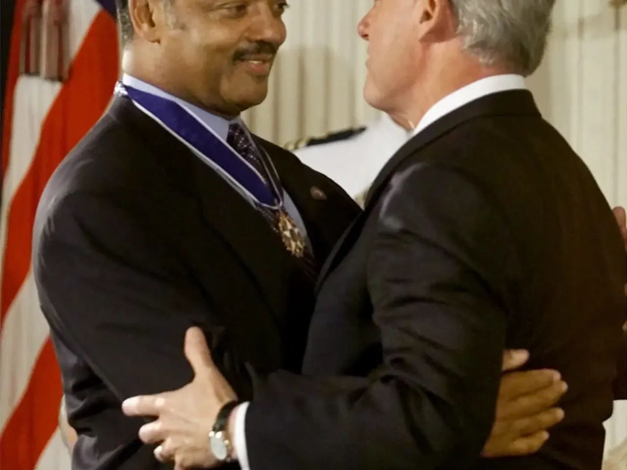 President Bill Clinton embraces the Rev. Jesse Jackson, founder and president of the Rainbow PUSH Coalition, after awarding him the Presidential Medal of Freedom during ceremonies in the East Room of the White House on Aug. 9, 2000, in Washington, D.C.