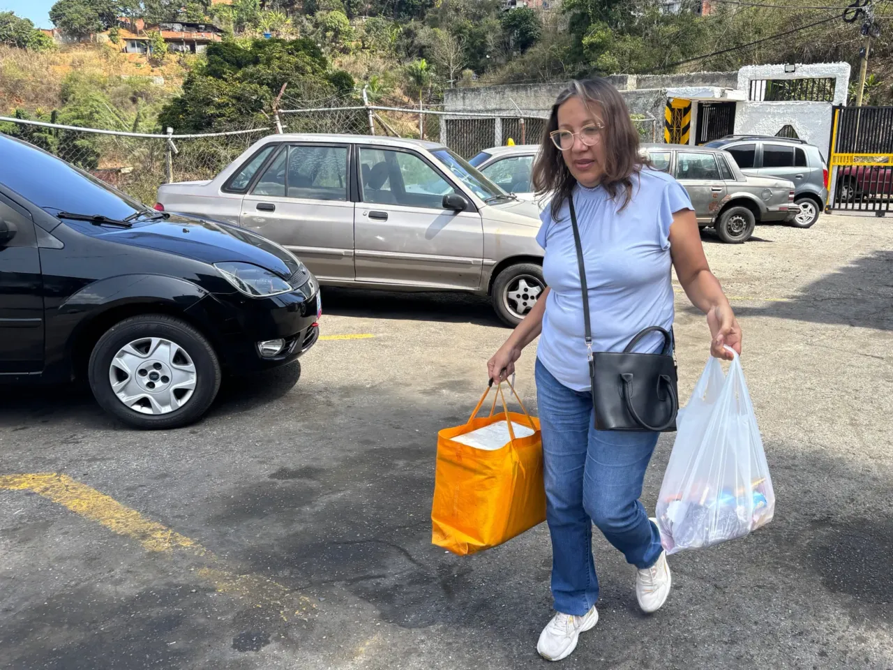Venezuela's oil revival brings hope but little relief for workers 2 Nelly Padilla, a public school teacher, sells ice creams to her neighbors, to supplement her monthly wages of $160.