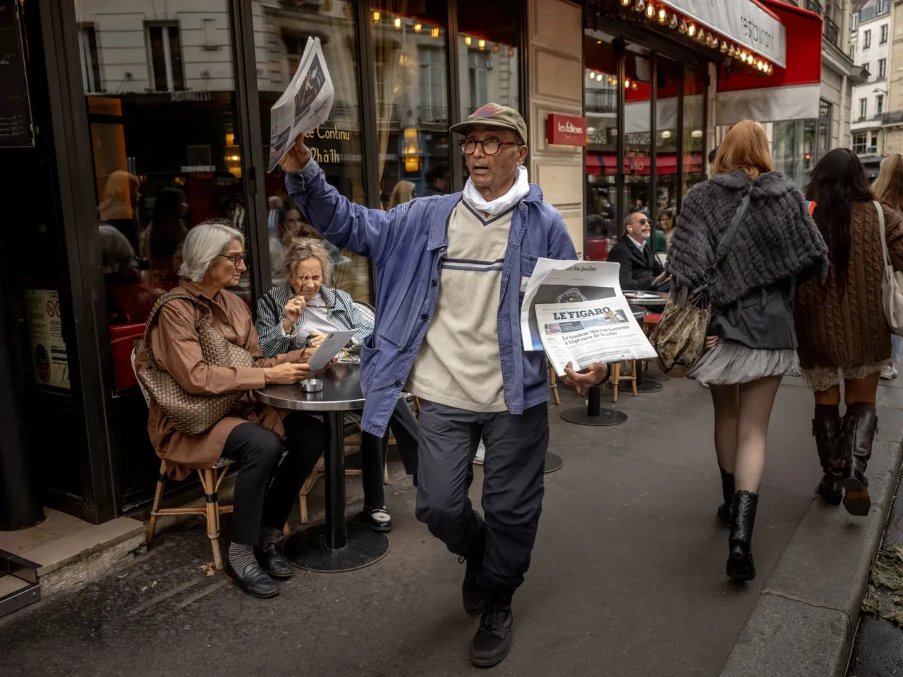 Ali Akbar sells newspapers in the Latin Quarter in Paris in September 2025. The Pakistani-born 73-year-old is believed to be the last remaining newspaper vendor in the French capital, and was awarded a knighthood by France's President Emmanuel Macron last month.