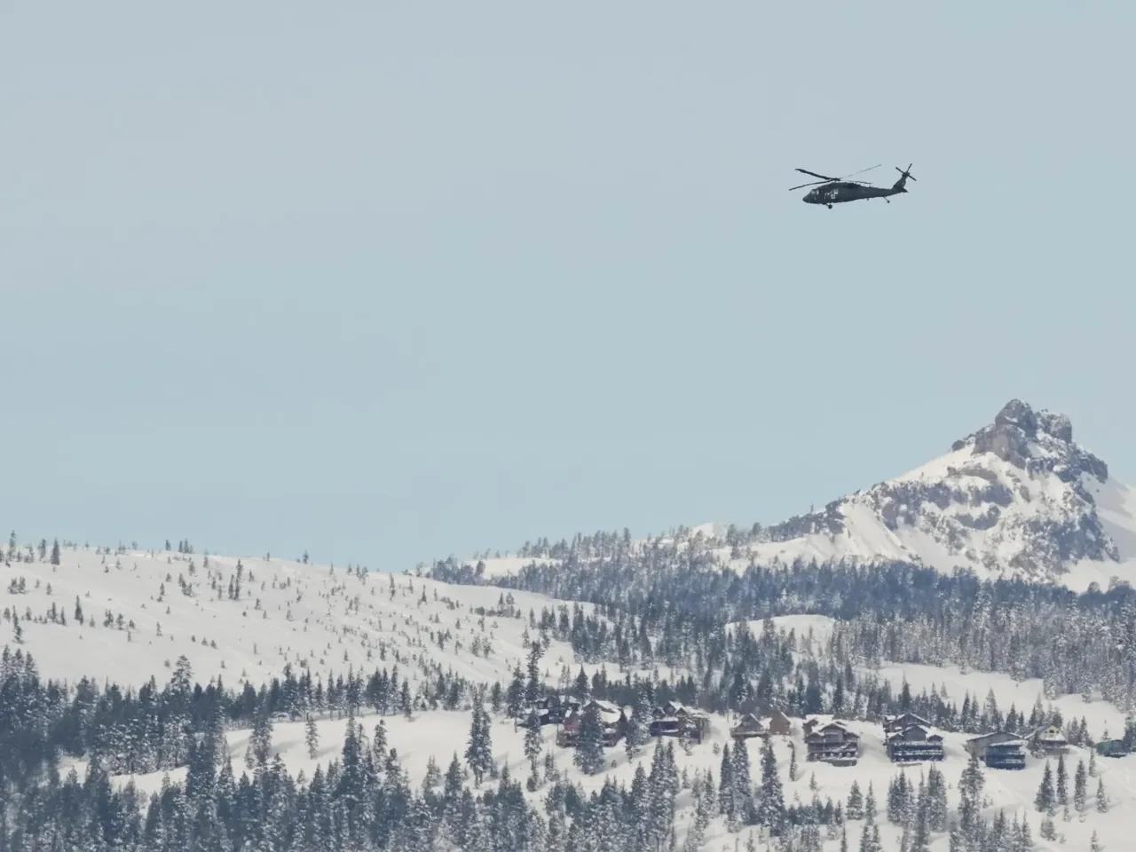 A U.S. Army Blackhawk helicopter flies toward the Castle Peak area of Northern California in recovery search for skiers on Saturday, after one of the deadliest avalanches in state history.