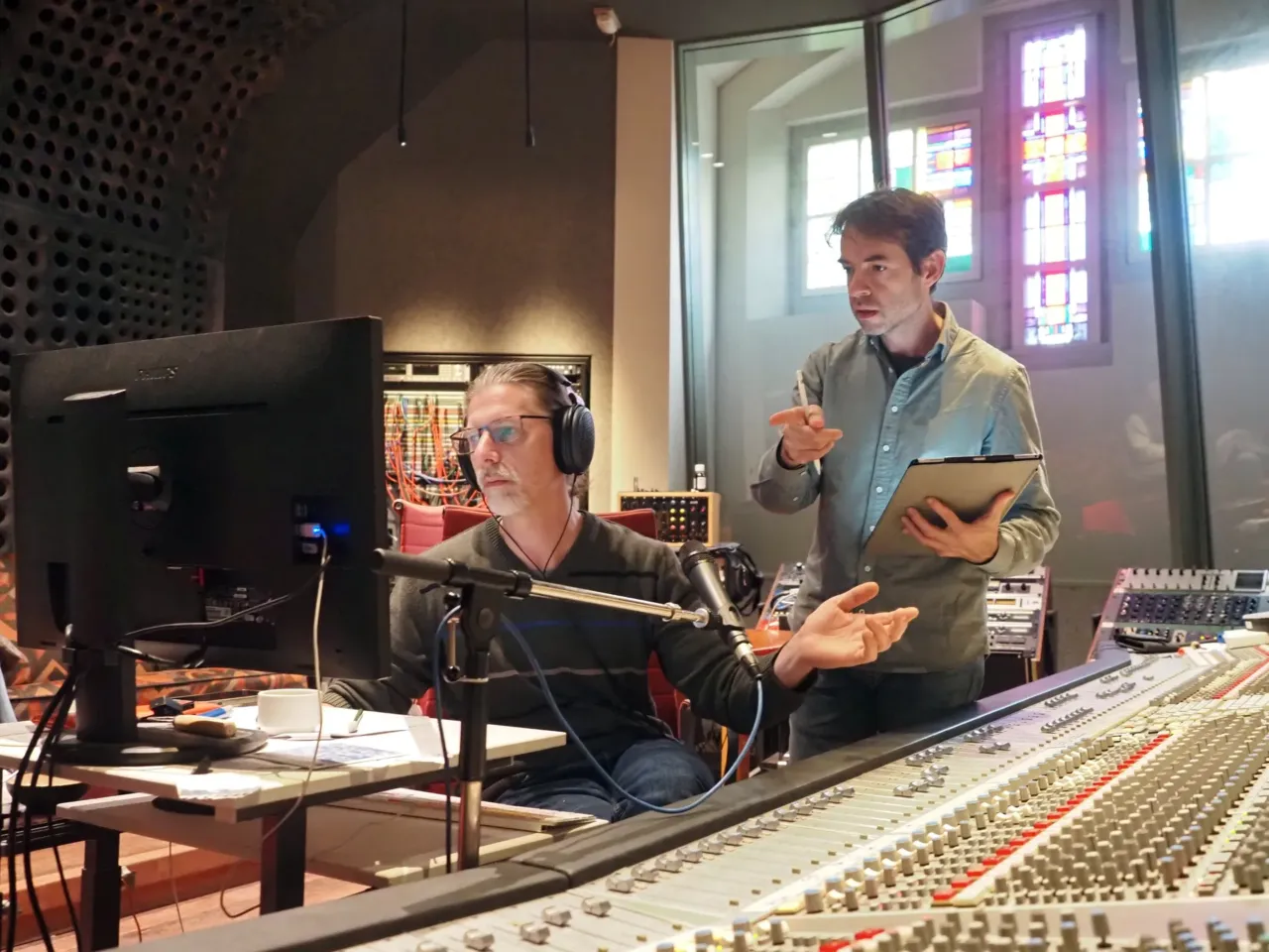 4 years into the war, a Ukrainian pianist processes Russia's invasion 1 Neselovskyi reviews the recording of his album, Perseverantia, with engineer Joeri Saal at Studio 150 Bethlehemkerk, in Amsterdam.