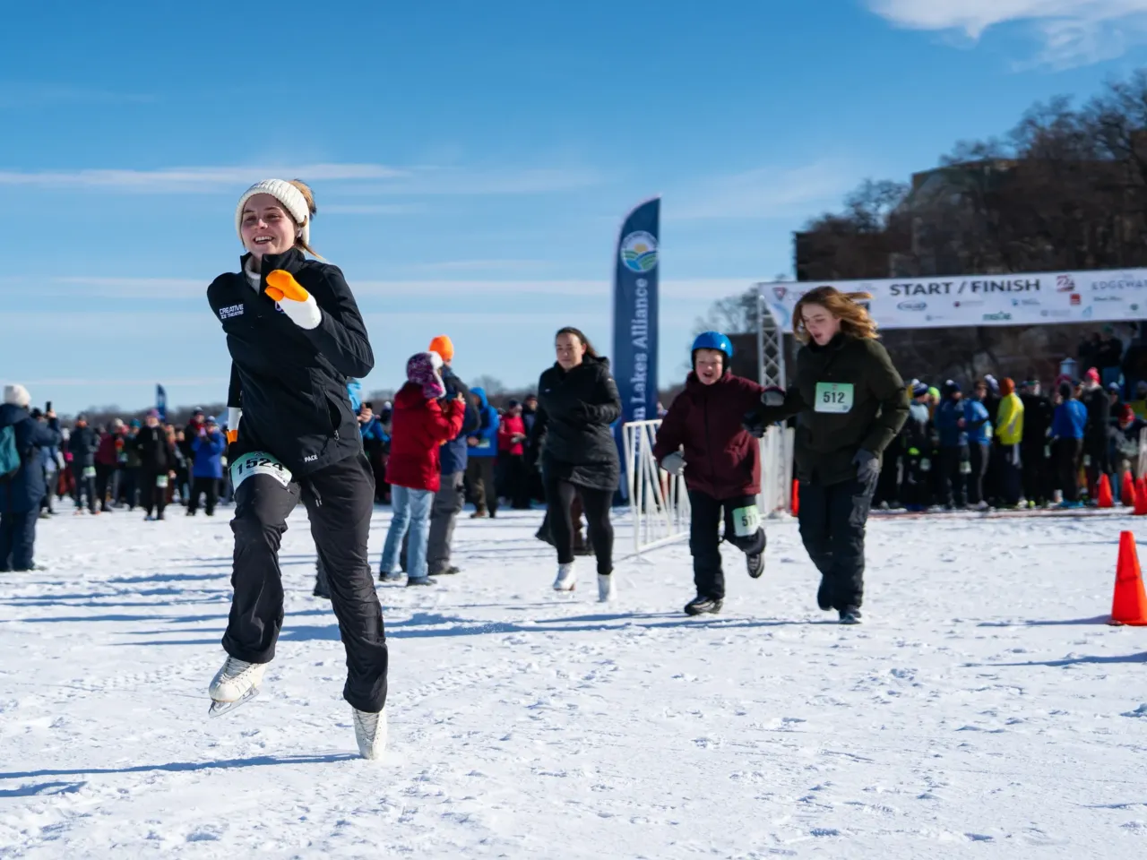 This community festival embraces the joys of a frozen lake — while it still has one 2 A competitor runs in ice skates during a 5K during the Frozen Assets Festival on Lake Mendota on Feb. 7 in Madison, Wis.