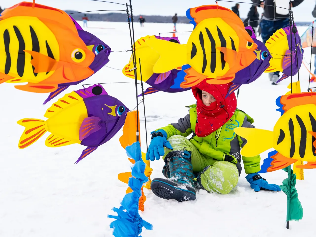 This community festival embraces the joys of a frozen lake — while it still has one 8 A child plays in a sea of fish kites at the Frozen Assets Festival on Lake Mendota.