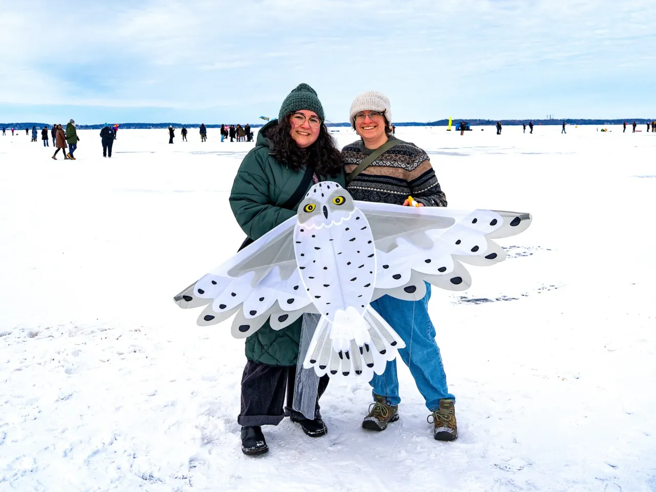 This community festival embraces the joys of a frozen lake — while it still has one 9 Tannia Serna (left) and Madeline Sudnick pose for a portrait with an owl kite on Lake Mendota during the annual Frozen Assets Festival.