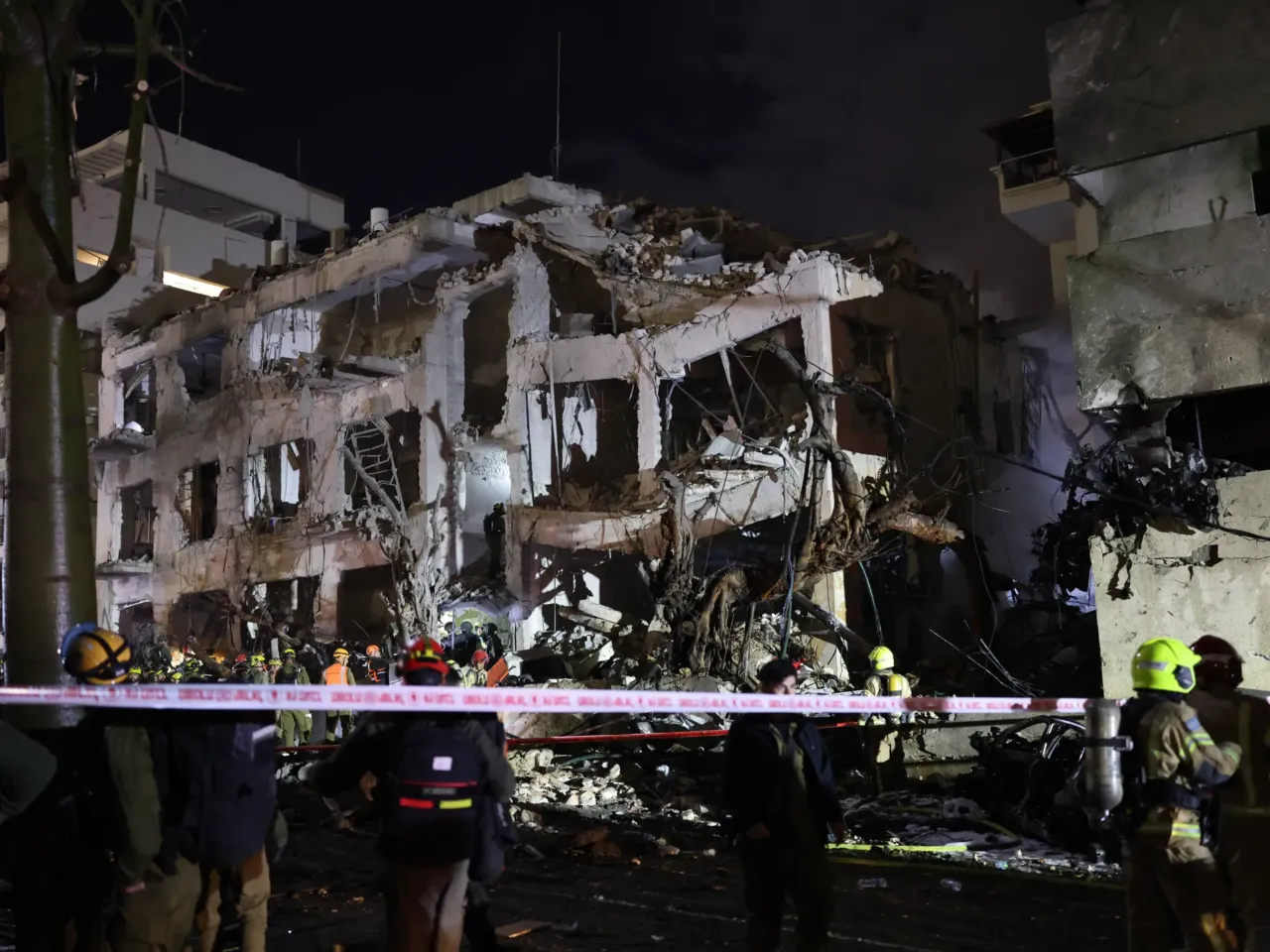 Israeli first responders arrive at the scene of an Iranian strike in retaliation for coordinated US-Israeli airstrikes in Tel Aviv on February 28, 2026.