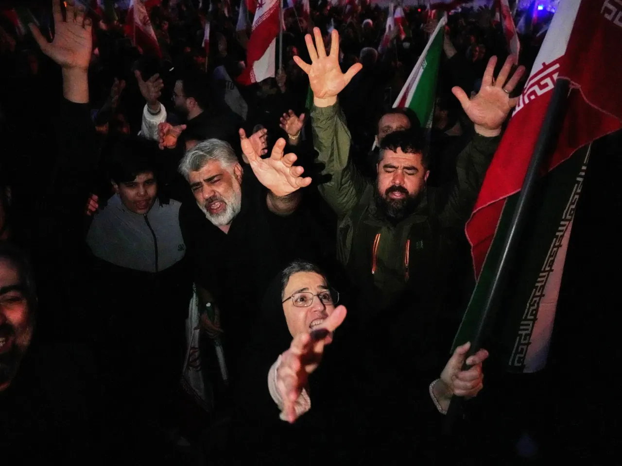 Government supporters chant slogans as they gather in mourning after state TV officially announced the death of Iranian Supreme Leader Ayatollah Ali Khamenei, in Tehran, Iran, Sunday, March 1, 2026.