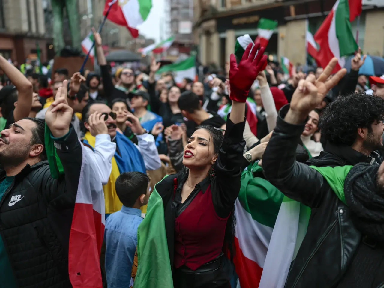 Members of the Iranian community take part in celebrations following the U.S. and Israeli strikes on Iran on March 01, 2026 in Glasgow, Scotland.