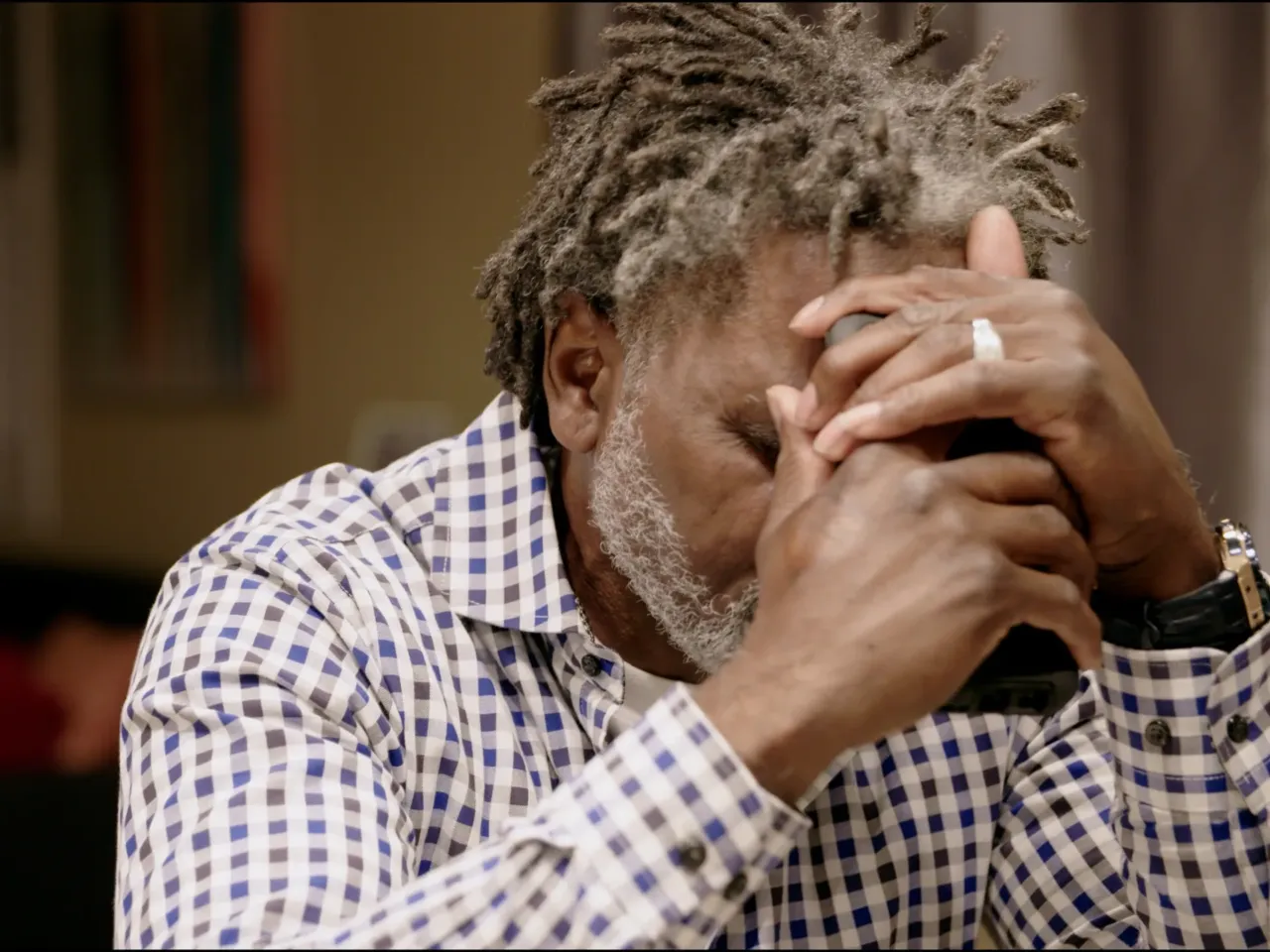 In 2021, Jacobs was denied parole. His father, pictured here, grapples with the news while trying to comfort his son.