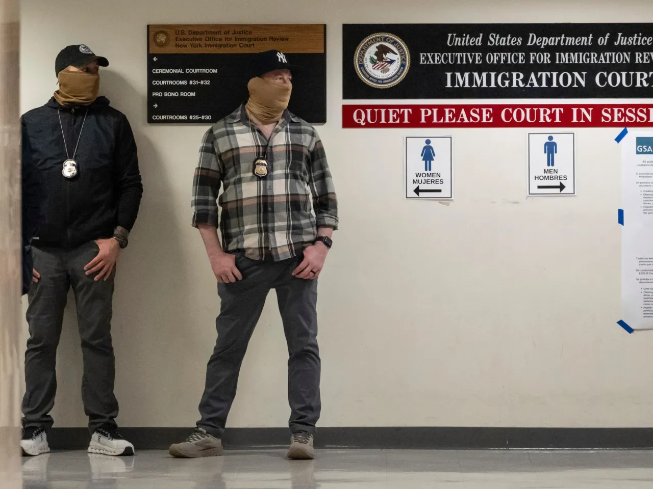 Cases in immigration courts nationwide can be appealed to the Board of Immigration Appeals. Here, federal agents stand outside an immigration court in New York on March 6, 2026.