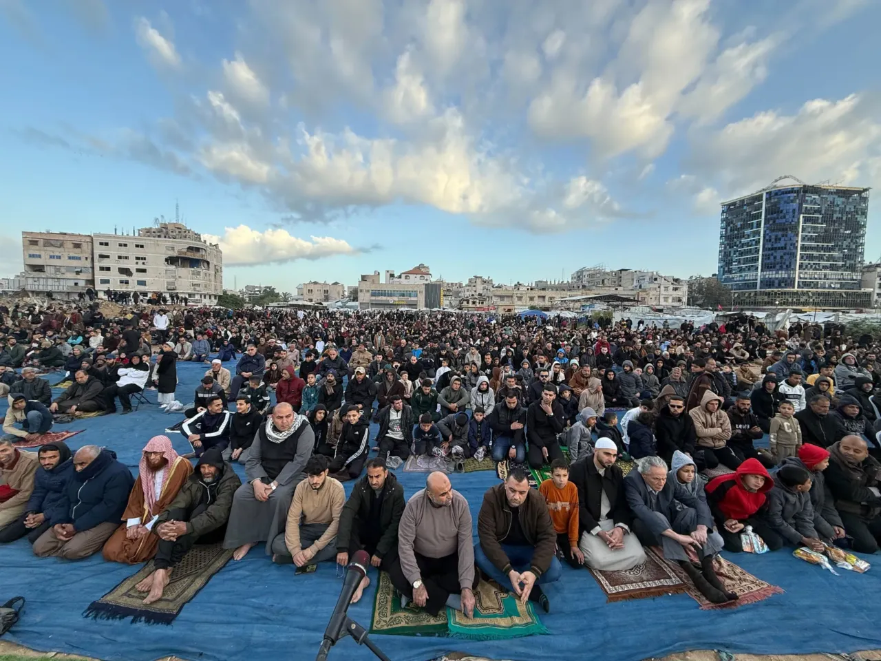 Palestinians celebrate Eid in Gaza, making the most of a fragile ceasefire 1 People gather for prayers on Eid in Gaza City on Friday.