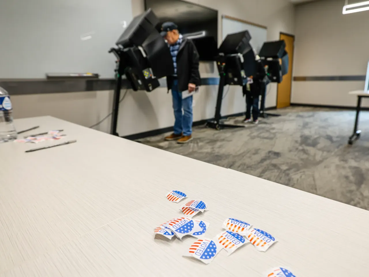 People cast ballots during early voting in Waukesha, Wis., on March 18, 2025.