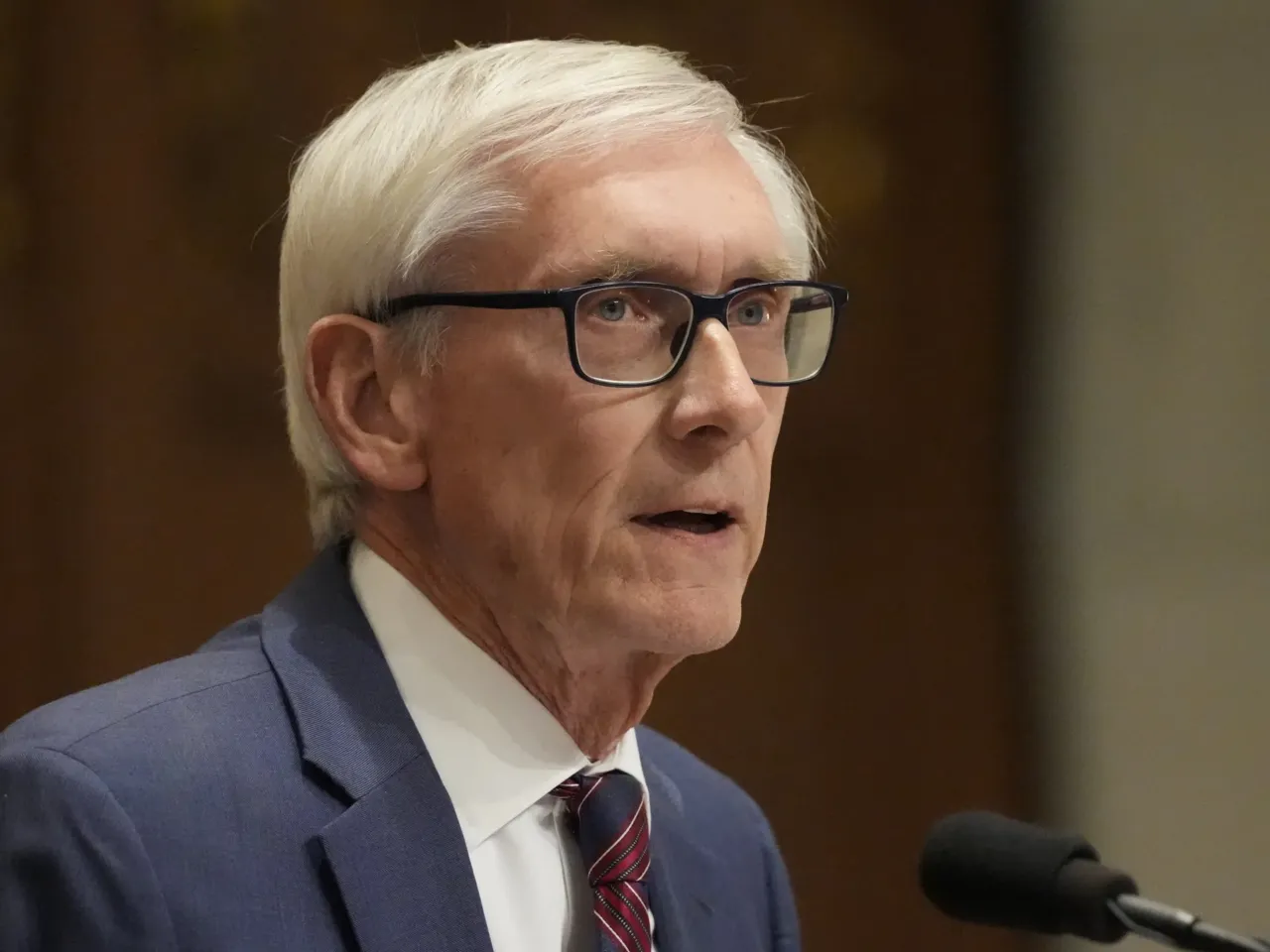 Wisconsin Gov. Tony Evers speaks at the state Capitol in Madison in early 2025. Evers, who won't seek another term in office, is seeking a constitutional amendment that would ban partisan gerrymandering in Wisconsin.