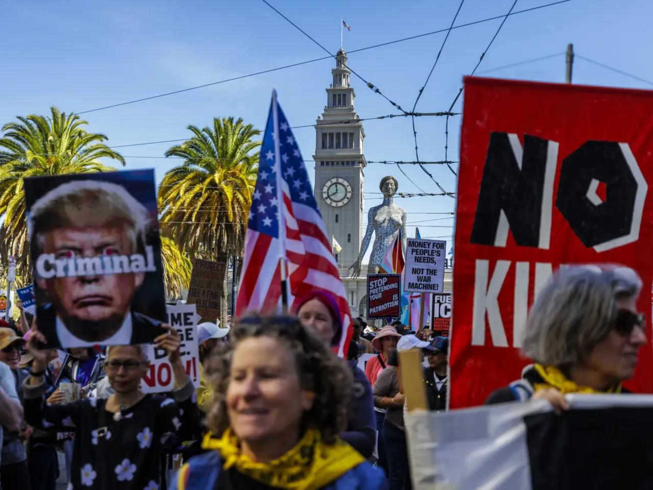 Crowds assemble at the Embarcadero in San Francisco prior to the start of the protest.