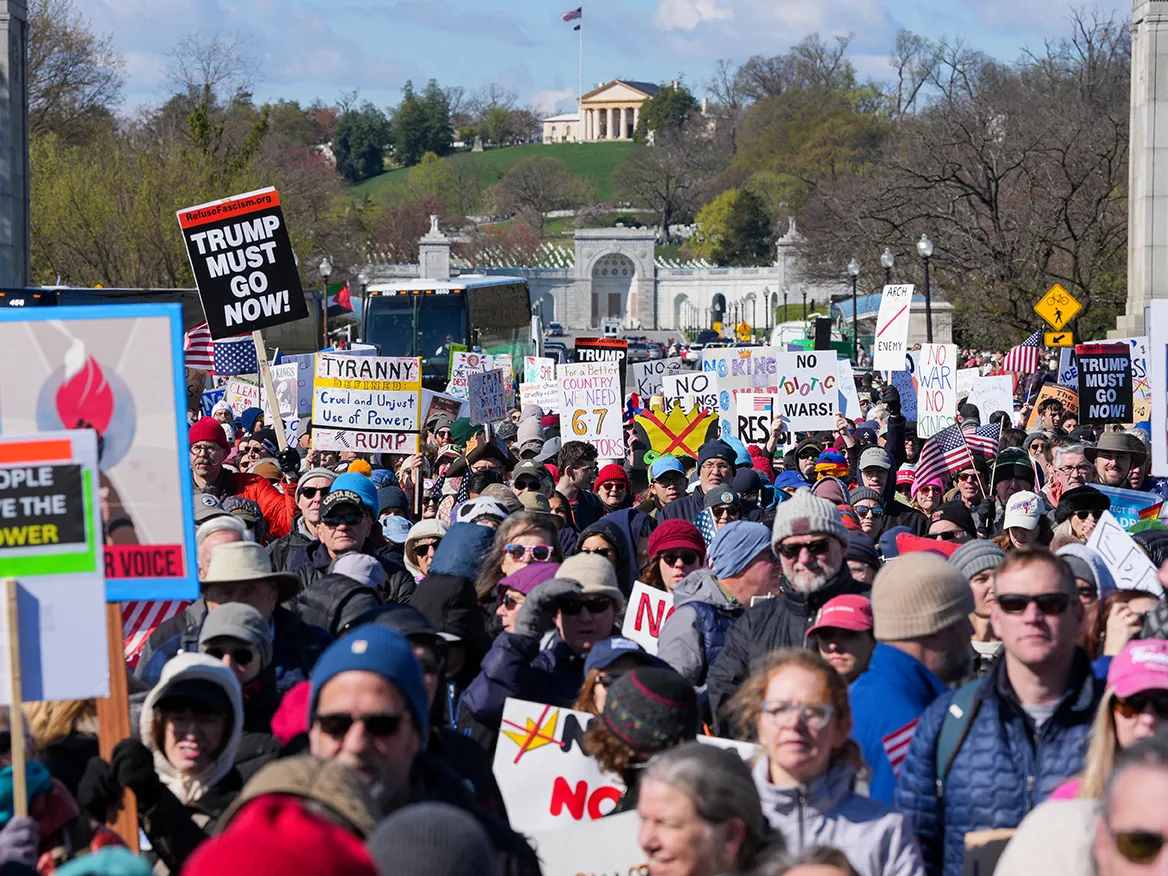 Demonstrators walk across the Memorial Bridge from Arlington, Virginia into Washington, DC.