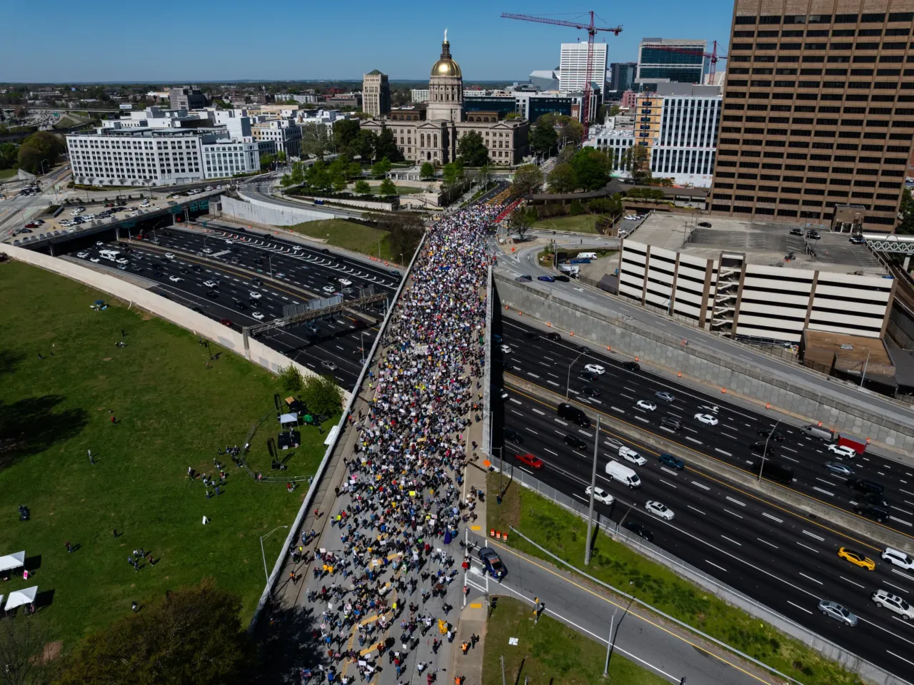 Protestors march across an overpass near the Georgia state Capitol building in Atlanta.