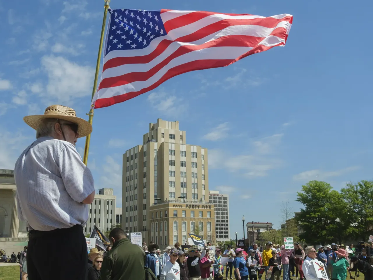 Lindsay Holliday waves an American flag in Rosa Parks Square in Macon, Georgia.