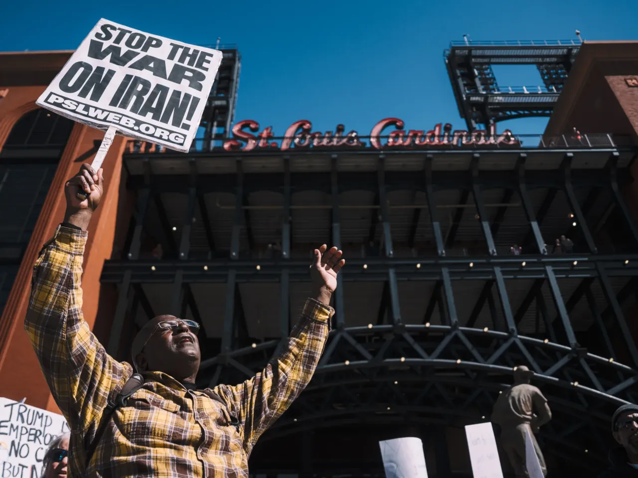 Duane Inge, a 63-year-old demonstrator, protests in front of Busch Stadium in downtown St. Louis.