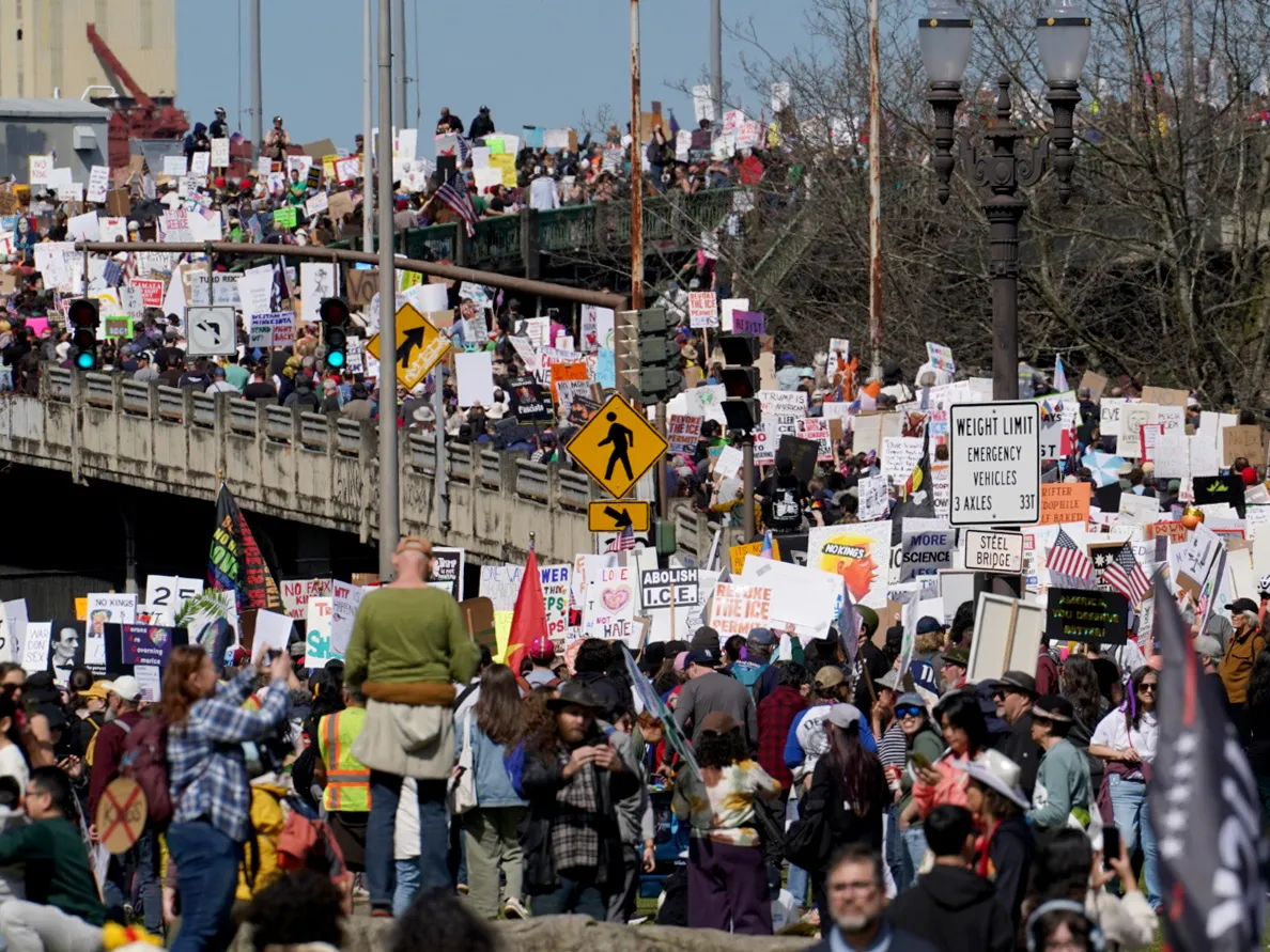Thousands march towards the Steel Bridge from the waterfront in Portland, Oregon.
