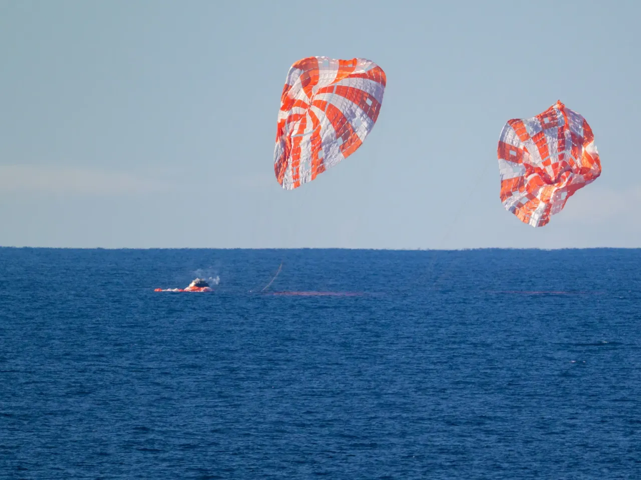 Artemis II splashdown captures nationwide attention 1 NASA's Orion spacecraft with Artemis II crewmembers NASA astronauts Reid Wiseman, commander; Victor Glover, pilot; Christina Koch, mission specialist; and CSA (Canadian Space Agency) astronaut Jeremy Hansen, mission specialist aboard is seen as it lands in the Pacific Ocean off the coast of California, Friday, April 10, 2026.