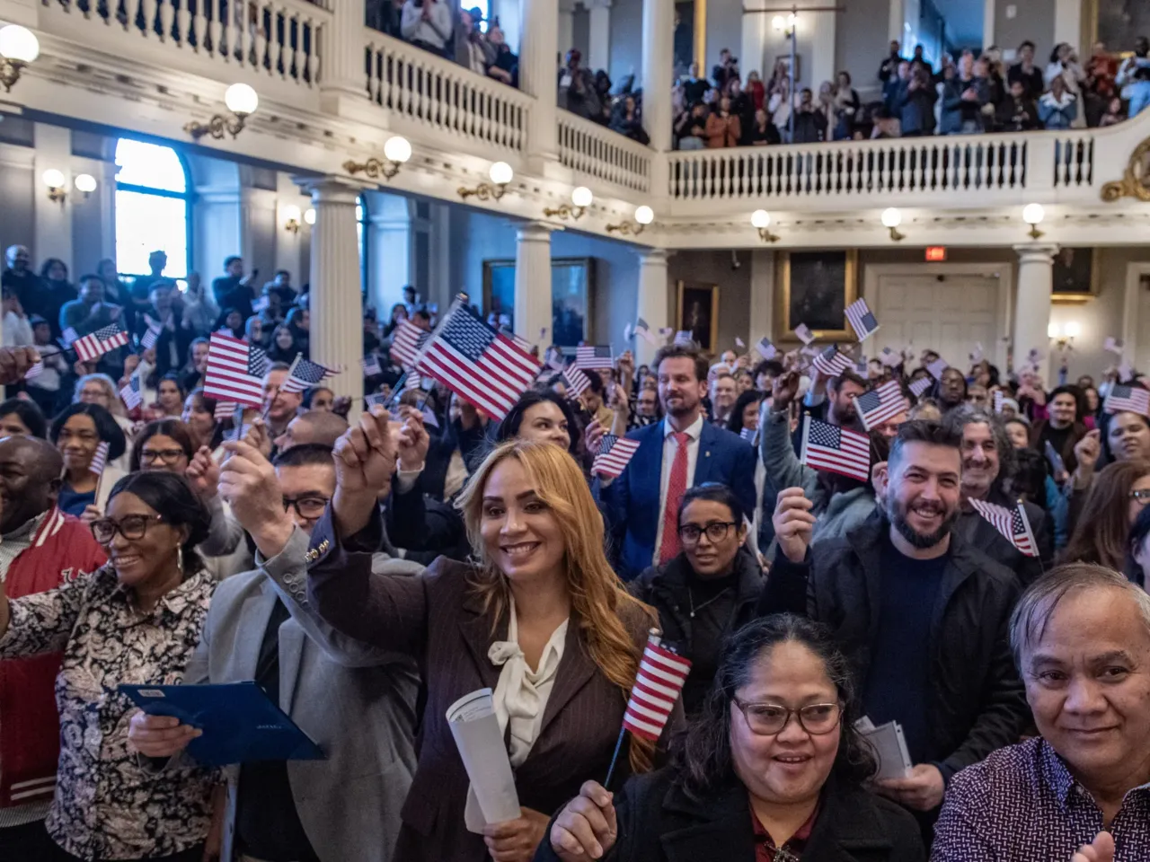New U.S. citizens take part in a naturalization ceremony at Faneuil Hall in Boston on Jan. 8.