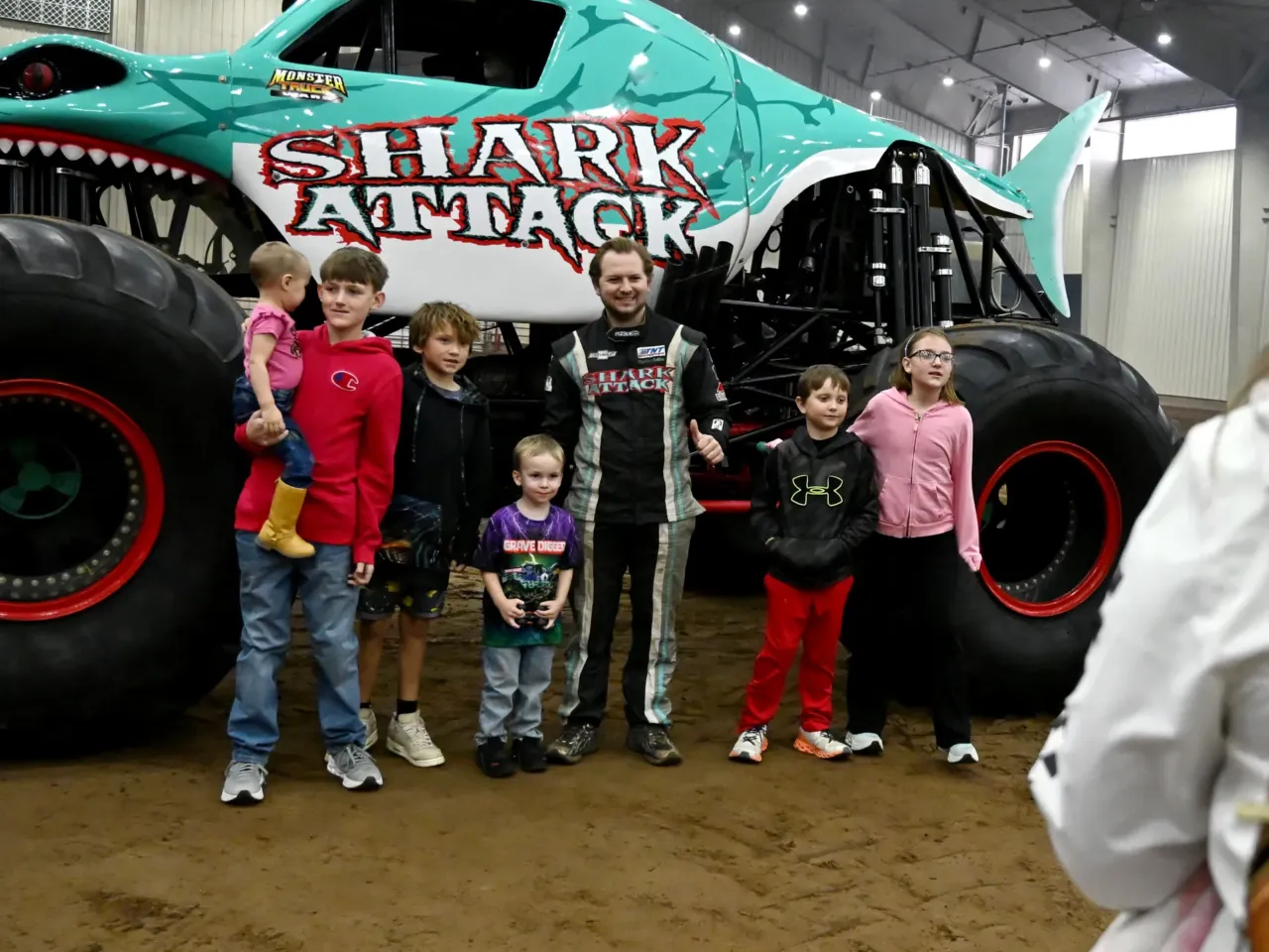 Monster trucks find a big audience with little kids 2 The McCurry children, of Shallowater, Texas, get their photo with Jerry Furajter, driver of Shark Attack. "I like ... the sound of them ... and how big the tires are," says 8-year-old Tobias, second from right.