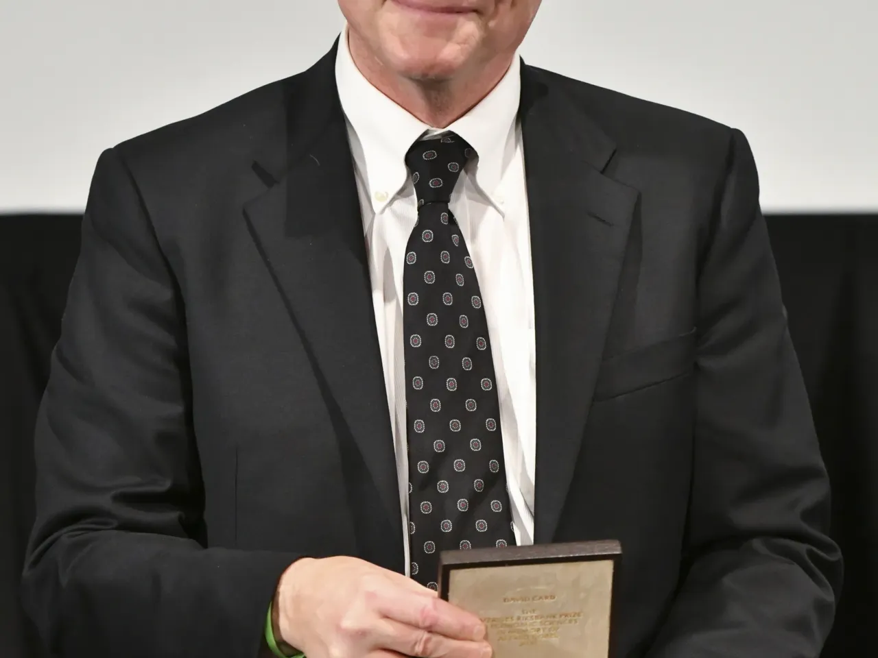 The hidden power keeping wages low 2 IRVINE, CALIFORNIA - DECEMBER 08: David Card poses with his medal after receiving Nobel Memorial Prize in Economic Sciences 'for work that challenged orthodoxy and dramatically shifted understanding of inequality and the social and economic forces that impact low-wage workers' on December 08, 2021 in Irvine, California. Due to the Covid-19 pandemic, the medal ceremony took place locally instead of the usual ceremony in Stockholm, Sweden. (Photo by Rodin Eckenroth/Getty Images)