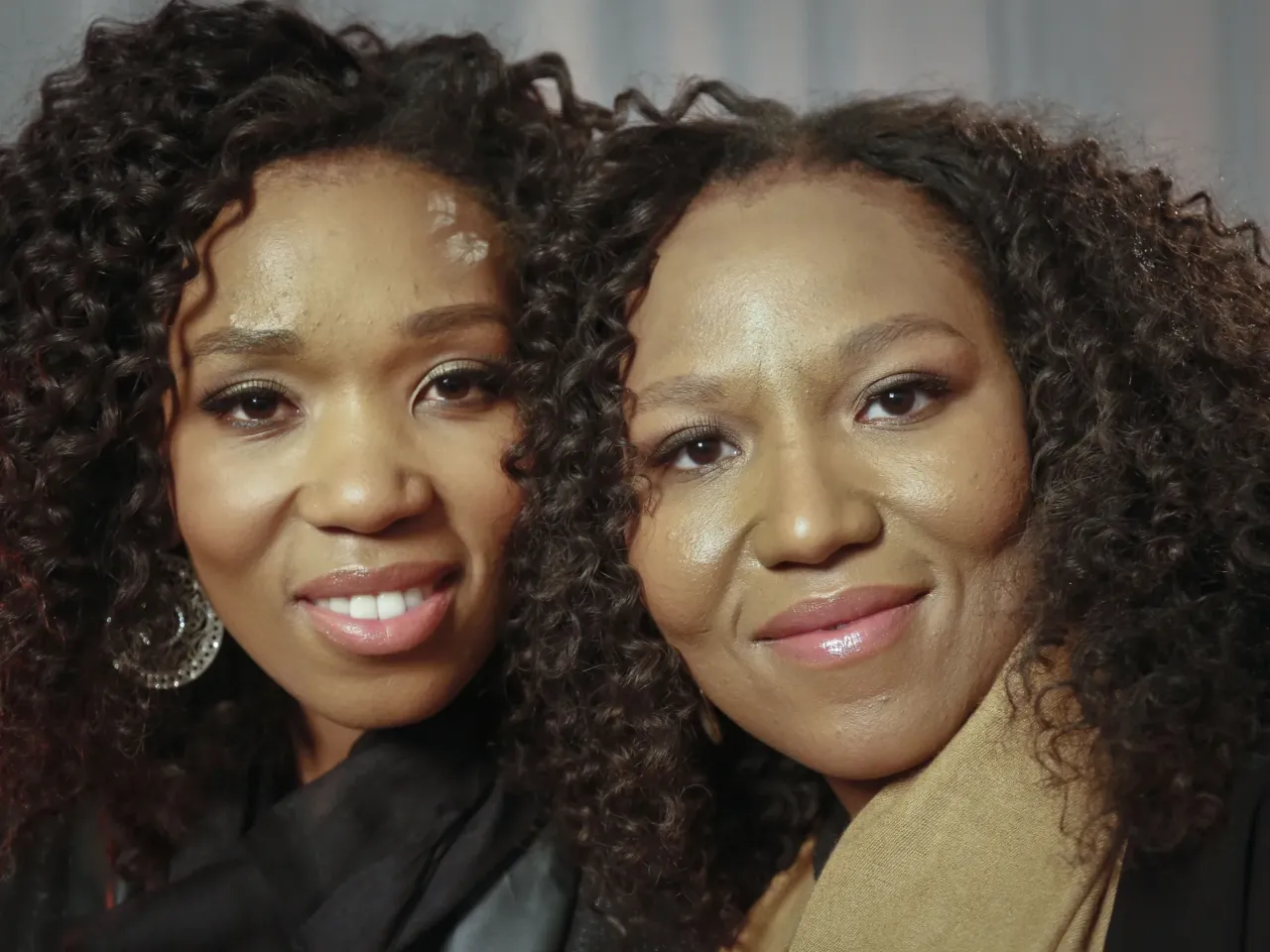 In this Wednesday, Feb. 6, 2013 photo, Swati Dlamini-Mandela, left, and Zaziwe Mandela-Manaway, granddaughters of Nelson and Winnie Mandela, pose during an interview in New York.