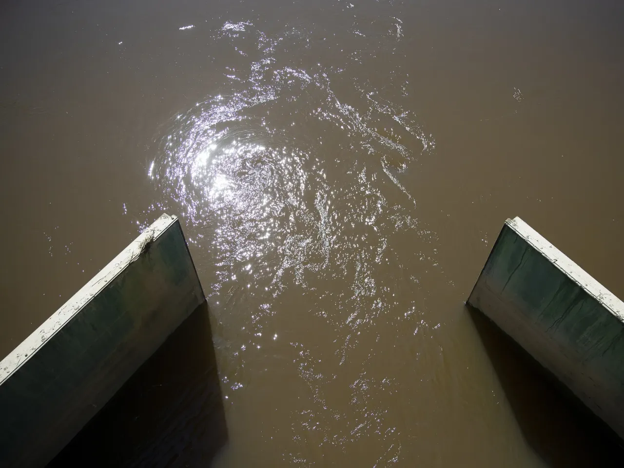 Water flows between Skagit Bay and the Tom Moore Slough levee, near Big Ditch, on April 8, 2026, near Stanwood, Wash.