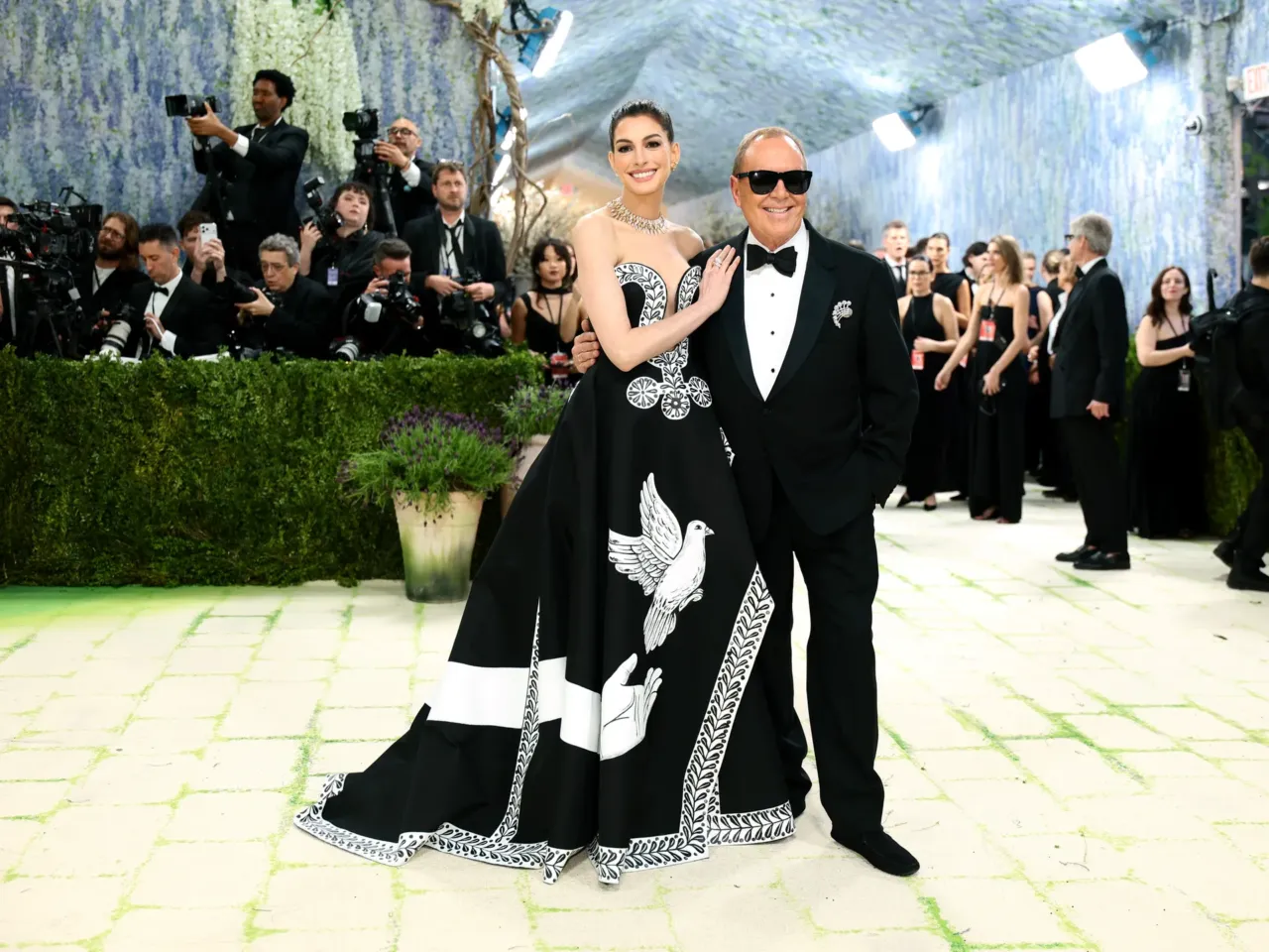 Anne Hathaway and fashion designer Michael Kors attend the 2026 Met Gala.