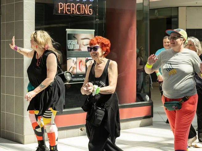 This flashy group of Portland mall walkers puts neon pep into their step 2 The Food Court 5000 at the Lloyd Center in Portland, Ore.